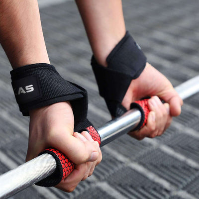 Hands gripping a barbell with Lifting Palm Dumbbell Grips Pads for enhanced stability and performance during workouts.